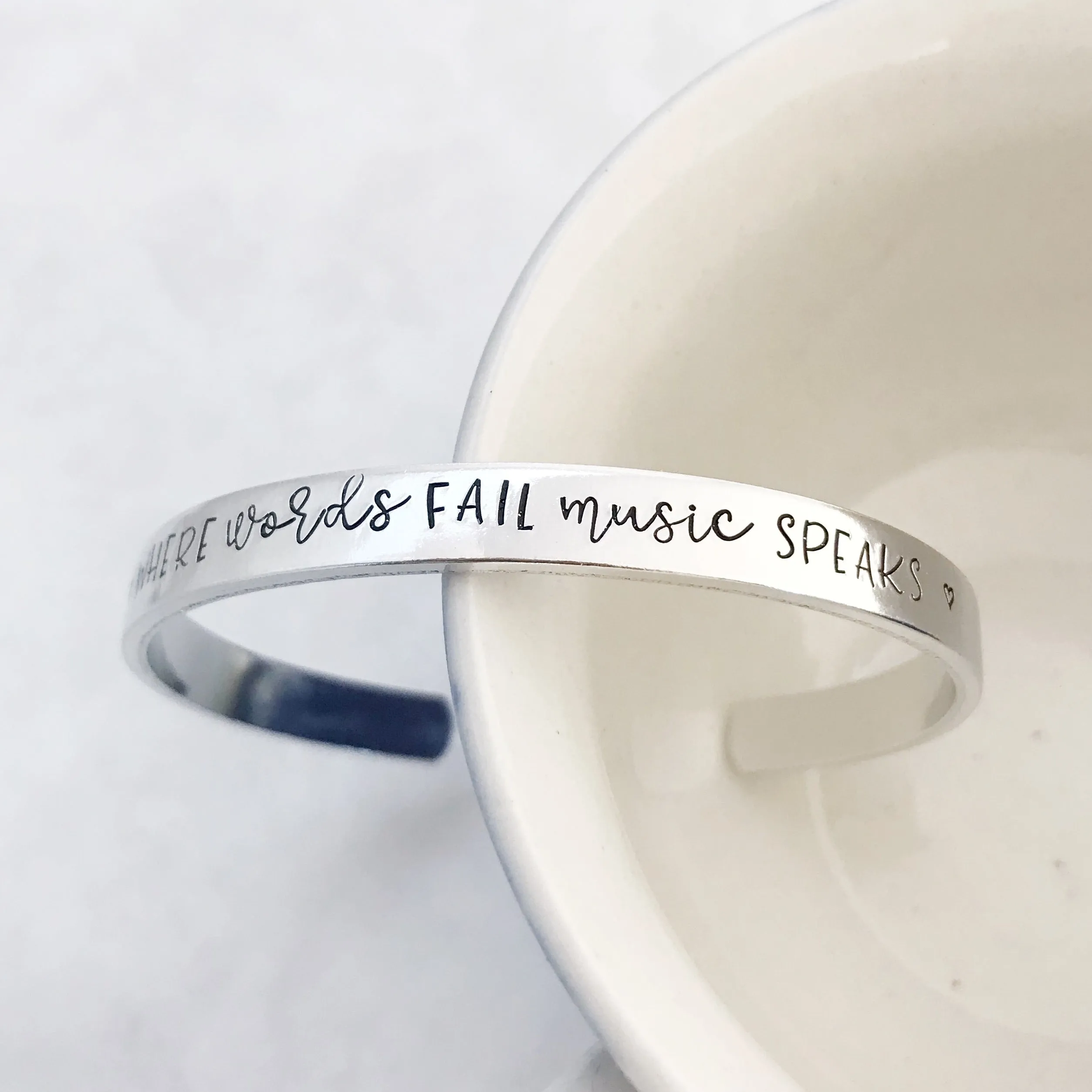 “Where words fail music speaks” cuff